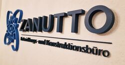 3D-Wandlogo von ZANUTTO Konstruktionsbüro mit Carbonoptik